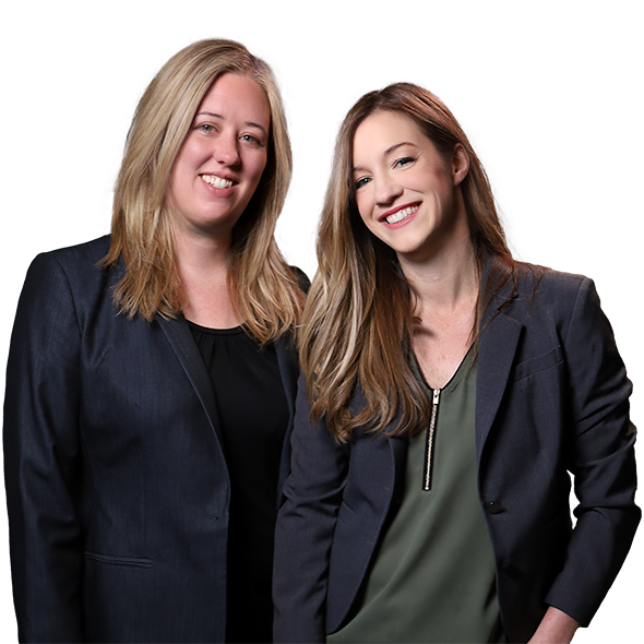 Kathryn Sheely and Jennifer Gerch, attorneys, standing together and smiling